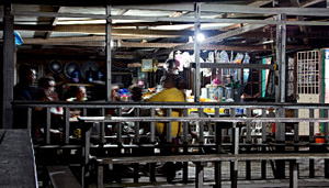 Typical scene in Tajur Biru where local men enjoy hanging around in a local store to play domino and chit-chatting.